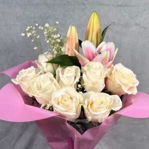 peach roses pink lilies bouquet with glass vase