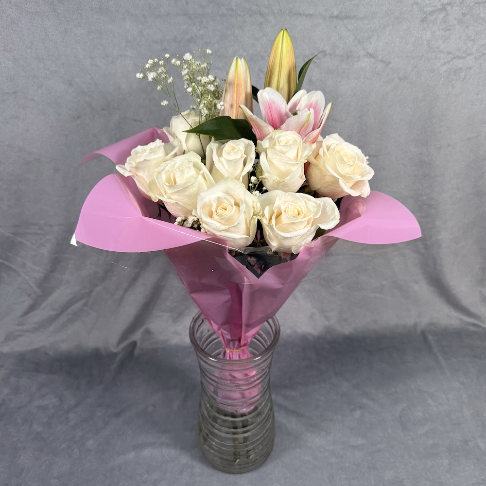 peach roses pink lilies bouquet with glass vase