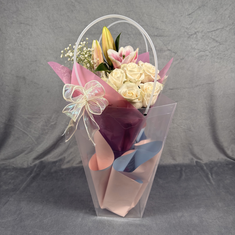 peach roses pink lilies bouquet with glass vase