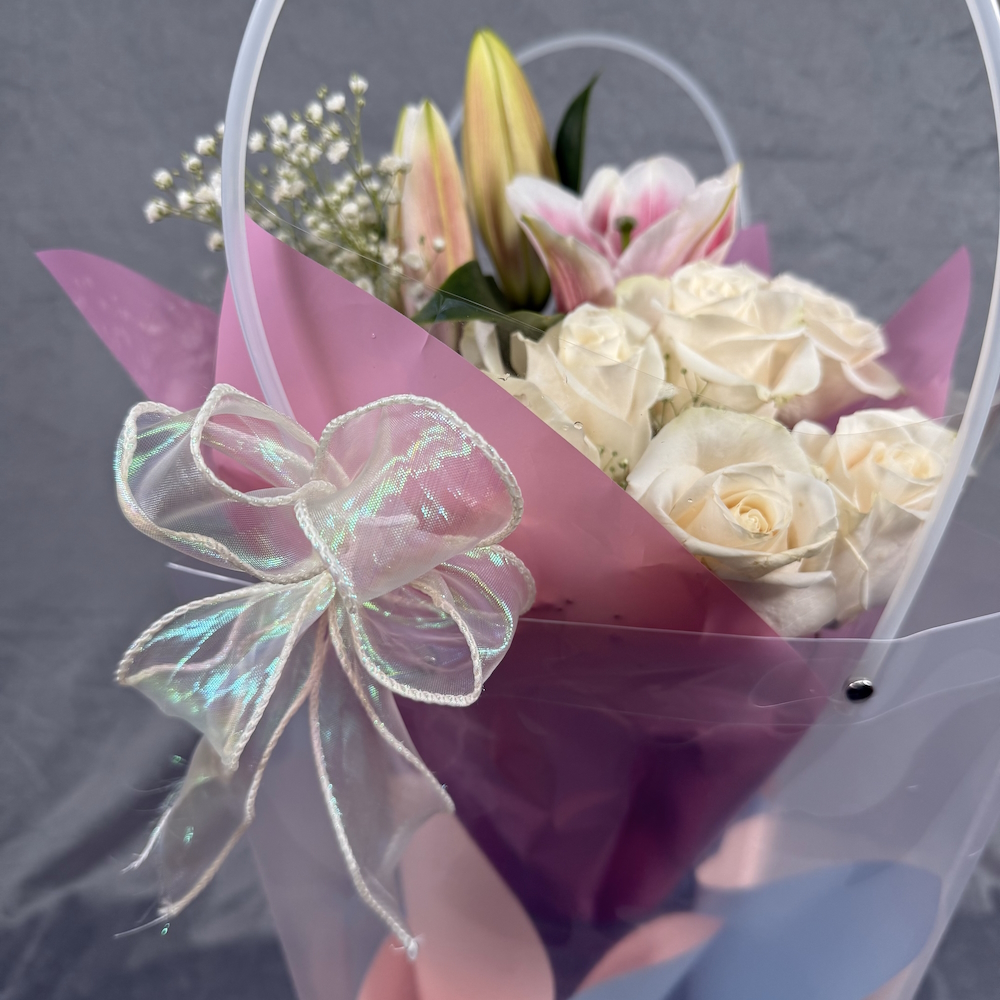 peach roses pink lilies bouquet with glass vase