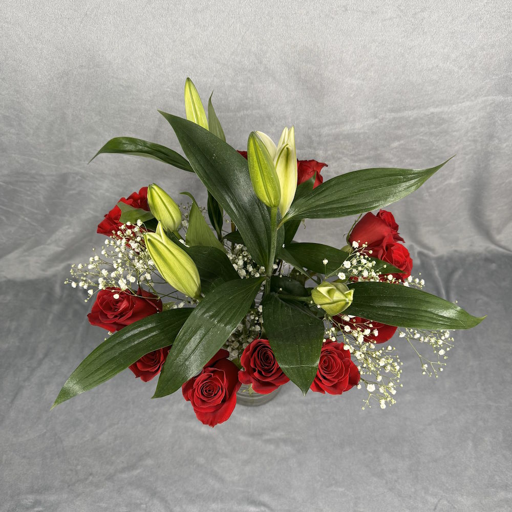 red roses white lilies bouquet with baby's breath and vase