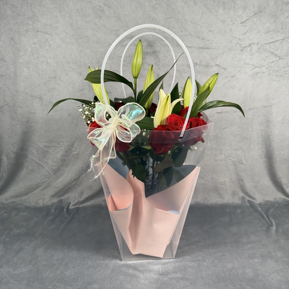 red roses white lilies bouquet with baby's breath and vase