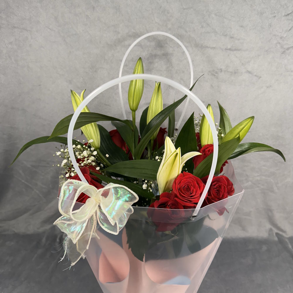 red roses white lilies bouquet with baby's breath and vase